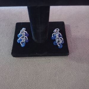 Silver tone chain link dangle earrings with blue beads. Needs fish hook backings